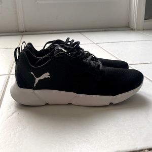 Black and white Puma shoes size 10.5. Wore once.